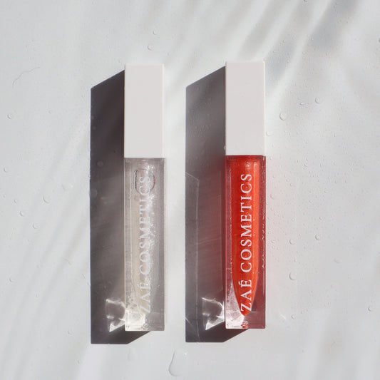 "Zaé shimmer lip gloss vegan sparkle"
"Zaé shimmer gloss cruelty-free glossy finish"
"Zaé shimmer lip gloss swatches shimmering"
"Zaé shimmer gloss packaging Zaè Cosmetics"