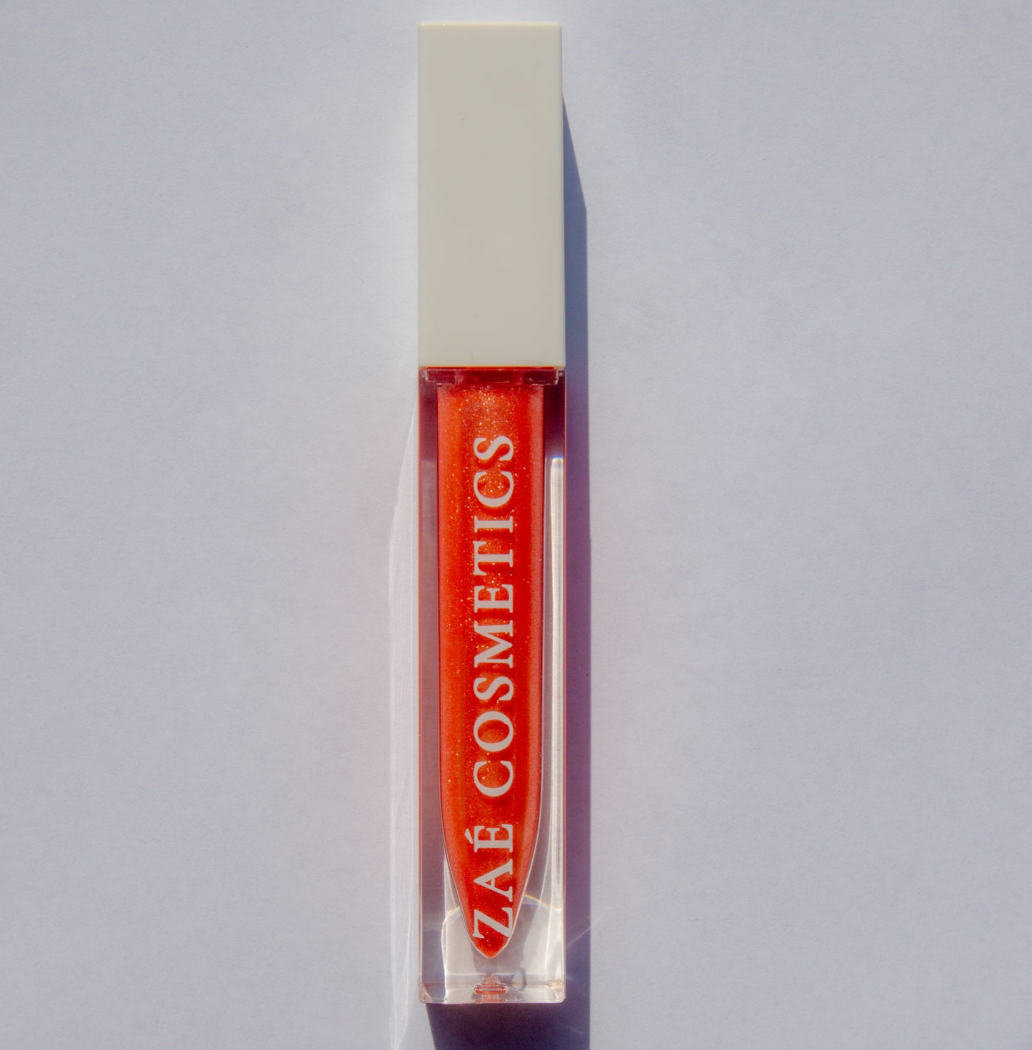 Zaé shimmer lip gloss vegan sparkle"
"Zaé shimmer gloss cruelty-free glossy finish"
"Zaé shimmer lip gloss swatches shimmering"
"Zaé shimmer gloss packaging Zaè Cosmetics
