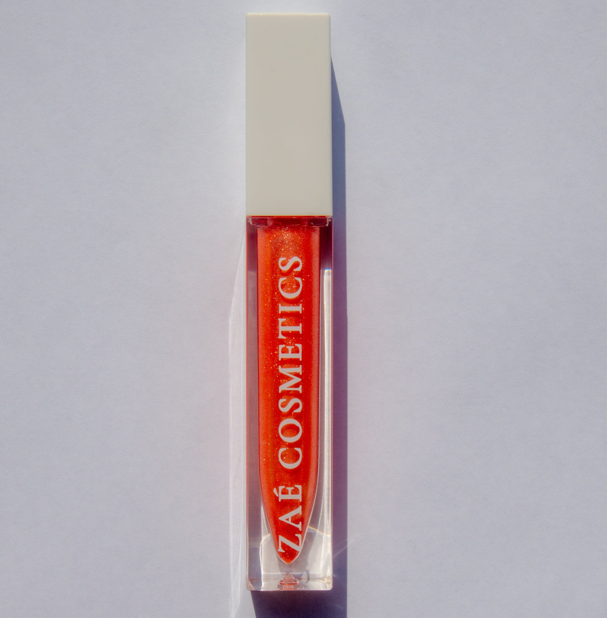 Zaé shimmer lip gloss vegan sparkle"
"Zaé shimmer gloss cruelty-free glossy finish"
"Zaé shimmer lip gloss swatches shimmering"
"Zaé shimmer gloss packaging Zaè Cosmetics